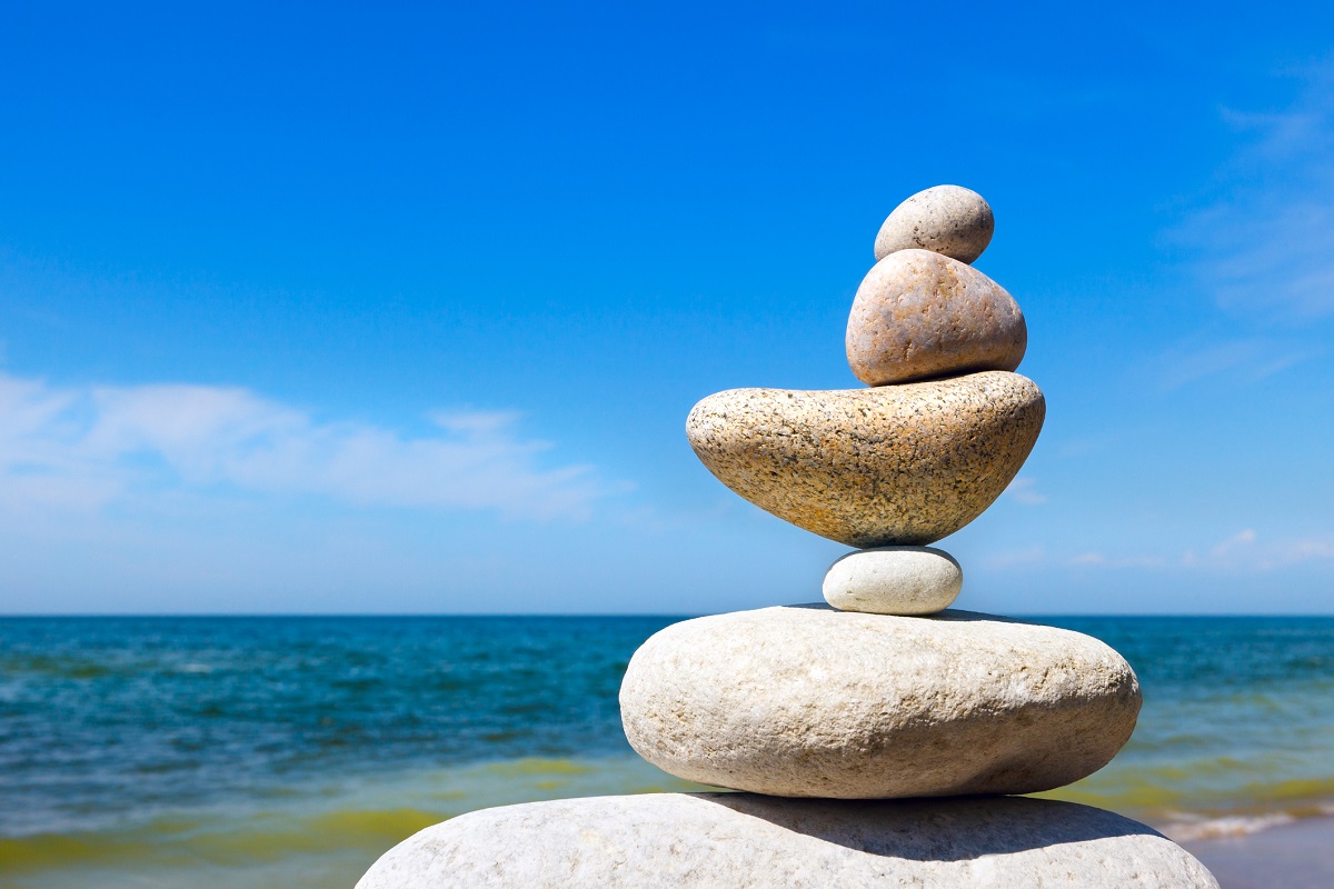 Rock Zen on the background of summer sea. Concept of harmony and balance
